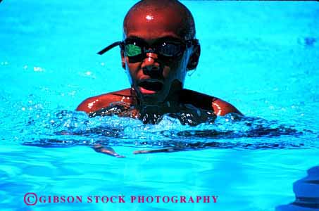 Stock Photo #2059: keywords -  african american black boy breaststroke breath child competition ethnic exercise exertion game goggles healthy horz not outdoor pool race released sport swim water