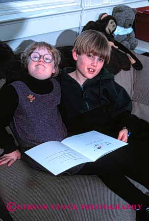 Stock Photo #2074: keywords - boy child children class classmate disability down education elementary friend gender girl handicap interact learn mix model needs released school share social special syndrome vert