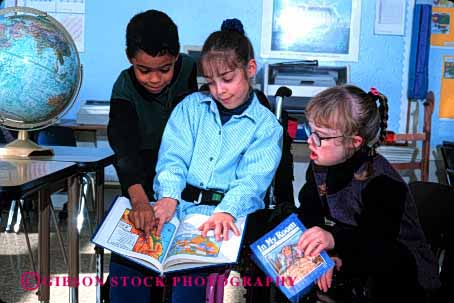 Stock Photo #2078: keywords -  boy child children class classmate disability down education elementary ethnic friend gender girl handicap horz interact learn mix model needs released school share social special syndrome team wheelchair