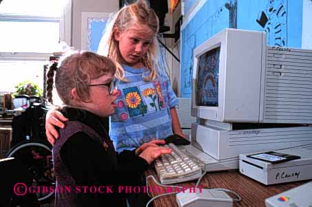 Stock Photo #2079: keywords -  challenaged child children class classmate classroom classrooms computer computers computing disabilities disability disable disabled education elementary friend friends friendship girl girls handicap handicapped horz interact kid kids learn need needs released school share social special student students team use uses using with