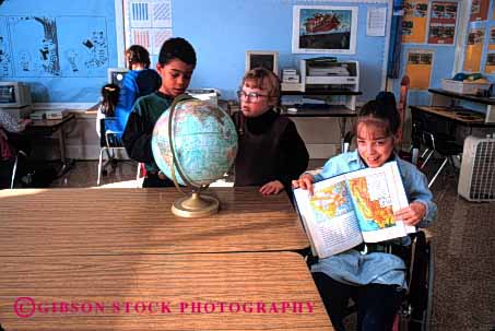 Stock Photo #2082: keywords -  atlas book boy boys challenged child childern children class classmate classoom disability disable disabled down education elementary ethnic friend gender genders geography girl girls globe globes handicap handicapped horz in interact kid kids learn lession mix mixed model needs released school share social special student students syndrome team wheelchair