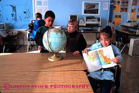 Stock Photo #2082: keywords - atlas book boy boys challenged child childern children class classmate classoom disability disable disabled down education elementary ethnic friend gender genders geography girl girls globe globes handicap handicapped horz in interact kid kids learn lession mix mixed model needs released school share social special student students syndrome team wheelchair