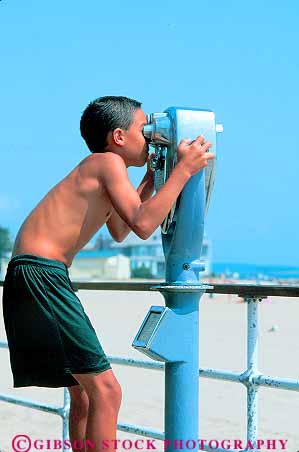 Stock Photo #11569: keywords - beach binocular boy boys child children connecticut equipment eyes lens lenses look looking looks machine machinery magnify pay see seeing sees sight telescope telescopes through vert vision youth