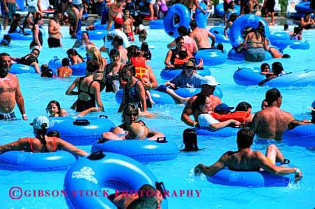 Stock Photo #2084: keywords -  crowd crowded group horz large many massive multitude numerous people play pool populous refresh summer swim water watermark wet