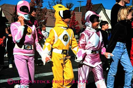 Stock Photo #2089: keywords -  age characters children colorful costume elementary friends hands hold horz parade share together