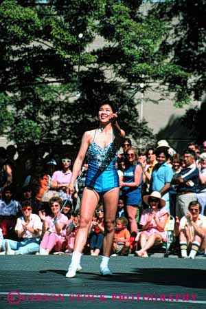 Stock Photo #2100: keywords -  asian balance baton coordination costume display ethnic girl not parade perform released skill summer twirler vert woman
