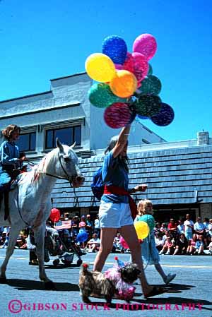 Stock Photo #2101: keywords -  balloon child children fourth horse july mother of parade pets vert walk