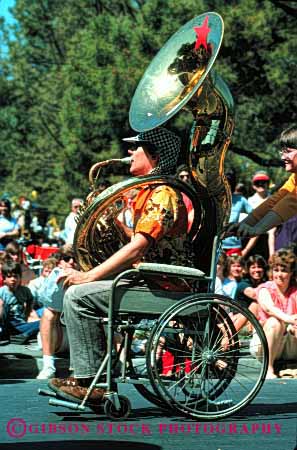 Stock Photo #2109: keywords -  disabled handicap instrument man music musician need not parade released roll special tuba vert wheelchair wind