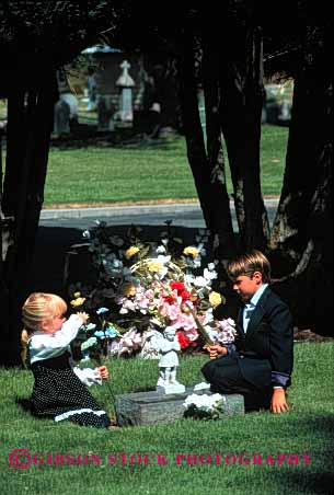 Stock Photo #2110: keywords -  boy brother cemetery child children commemorate daughter dead death family flowers girl grave loss model mourn parent released remembrance sad sister son tribute vert visit