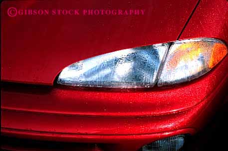 Stock Photo #2124: keywords -  auto automobile car dew drops headlight horz paint polish rain red shiny transportation vehicle water