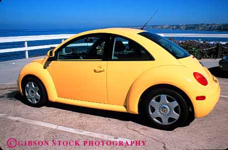 Stock Photo #2127: keywords - auto automobile bug car coast horz import modern paint polish redesign shiny transportation vehicle volkswagen yellow