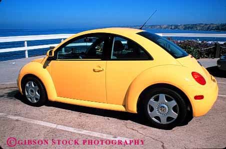 Stock Photo #2127: keywords -  auto automobile bug car coast horz import modern paint polish redesign shiny transportation vehicle volkswagen yellow