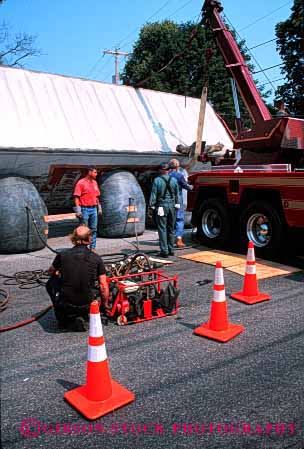 Stock Photo #2128: keywords -  accident caution claim damage danger equipment heavy injury insurance lift loss property rollover traffic truck vehicle vert