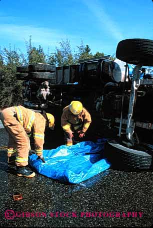 Stock Photo #2143: keywords -  accident caution claim cleanup collision contain crash damage danger dangerous diesel environment fire firemen fuel injury insurance job loss occupation property rollover spill toxic traffic truck vehicle vert work