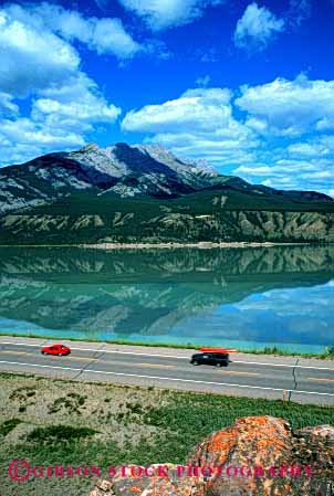 Stock Photo #2166: keywords -  auto camper canada cars drive highway jasper lake moving national park recreational reflection road rural scenic street transportation vehicle vert water