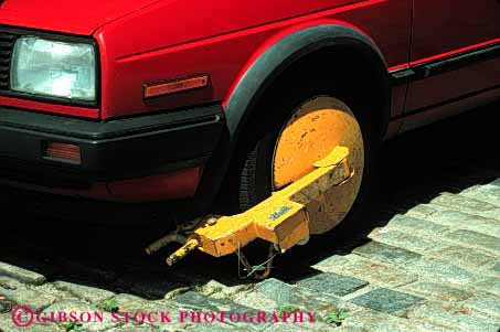 Stock Photo #2179: keywords -  auto boot car clamp denver enforcement expire horz lock park parked parking punishment tire vehicle violation wheel