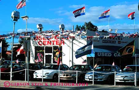 Stock Photo #2187: keywords -  advertise attention auto banner bright business car center commerce decorate flags getting horz lot sales sell trade transact used