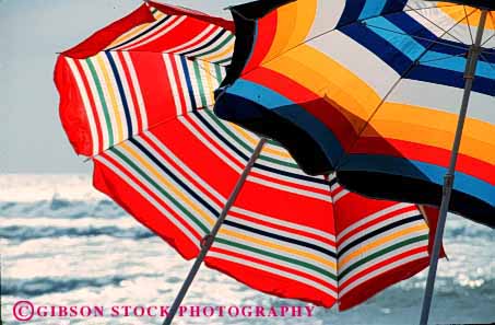 Stock Photo #2196: keywords -  abstract beach bright colorful geometric geometry horz pattern radial striped summer sun umbrellas