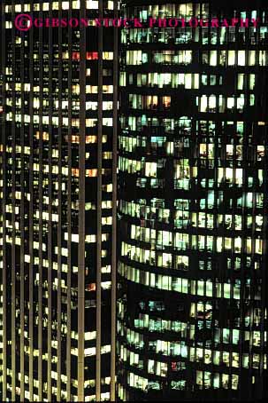 Stock Photo #2199: keywords -  building downtown geometric geometry grid high lighting night office pattern rise square vert windows