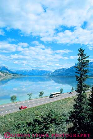 Stock Photo #14618: keywords - alberta bus buses busing canada cloud clouds commercial destination highway jasper lake lakes landscape mass national near park parks public road roads scenery scenic street streets tour touring tours transit transportation travel traveler travelers vacation vehicle vert