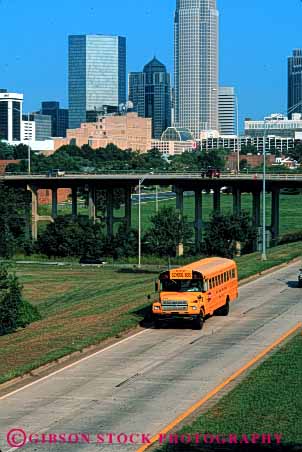 Stock Photo #6142: keywords -  bus buses charlotte city cityscape divided downtown drive highway mass move school students transit transport transportation travel vert