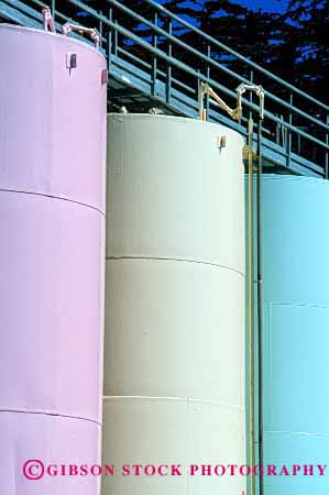 Stock Photo #2209: keywords -  chemical clean colorful cylinder equipment industry liquid manufacturing painted round storage tall tanks vert