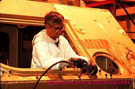 Stock Photo #2220: keywords -  aluminum assemble bradley ethnic factory fighting hispanic horz job labor machine male man manufacture manufacturing metal military minority model occupation power profession released tool transport troop uniform vehicle war work