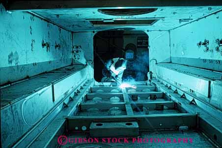 Stock Photo #2221: keywords - aluminum arc assemble bradley burn danger factory fighting horz hot job labor machine manufacture manufacturing metal military occupation power profession risk tool transport troop uniform vehicle war welder work