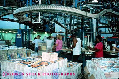 Stock Photo #2230: keywords - african amwerican assemble assembly black california collate communication contra costa equipment ethnic facility factory gender horz in industry job jobs labor line machine manufacture manufacturing minority mix news newspaper newsprint organize people person print process processing production publish sort stack times work worker workers working