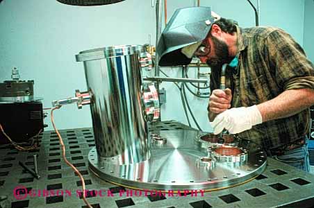 Stock Photo #2241: keywords - burn construction danger factory horz hot injury job labor manufacture manufacturing model professional protection released risk safety skill stainless steel welder