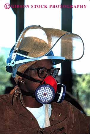 Stock Photo #2243: keywords -  african air american aspirator black breathing burn caution danger face filter fire foundry gear hardhat helmet hot industry injury jacket leather mask metal molten not occupational particle potential protection protective released risk safety scorch screen shield vert ware woman