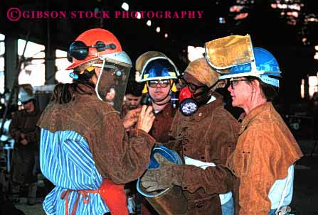 Stock Photo #2244: keywords -  african air american aspirator black breathing burn caution consult danger face filter fire foundry gear group hardhat helmet horz hot industry injury jacket leather listen mask metal molten not occupational particle potential protection protective released risk safety scorch screen share shield talk ware woman women