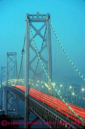 Stock Photo #2268: keywords -  auto bay blur bridge california car city commute dawn drive exposure francisco hour light long motion movement red road rush san streak street sunrise time traffic transportation travel urban vehicle vert