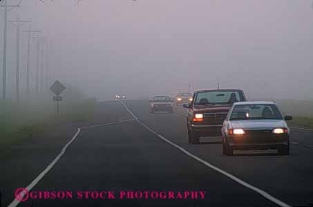 Stock Photo #2286: keywords -  car caution cloud commute congestion danger drive dusk fog headlight highway horz impaired in injury low moisture risk road safety slow street traffic transportation vehicle visibility weather