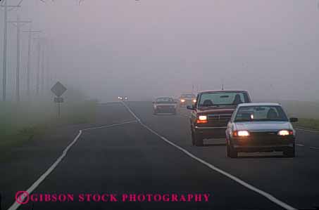 Stock Photo #2286: keywords - car caution cloud commute congestion danger drive dusk fog headlight highway horz impaired in injury low moisture risk road safety slow street traffic transportation vehicle visibility weather