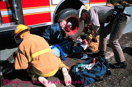 Stock Photo #2306: keywords -  accident aid care career emergency firemen first horz income injury job medical occupation police public safety service suit treat uniform victim vocation work