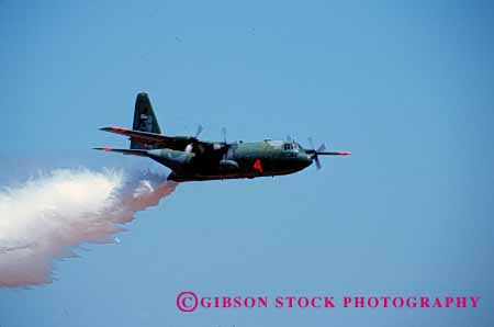 Stock Photo #2315: keywords -  airplane drop fight fire fly forest horz suppression tanker water wild