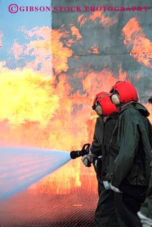 Stock Photo #2317: keywords -  burn cooperate danger education emergency fire firemen flame gear heat hose hot injury learn navy practice protective risk suit team train training vert water