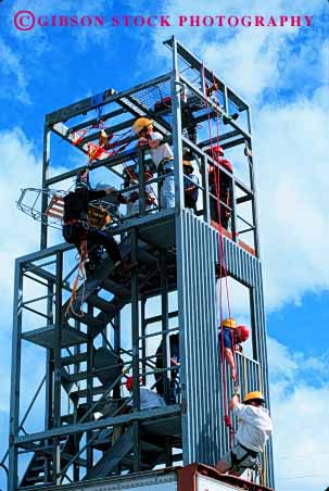 Stock Photo #2320: keywords -  burn class cooperate danger education emergency firemen injury learn practice repel rescue risk suit team tower train training vert