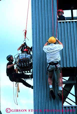 Stock Photo #2321: keywords -  burn class cooperate danger education emergency firemen injury learn practice repel rescue risk suit team tower train training vert