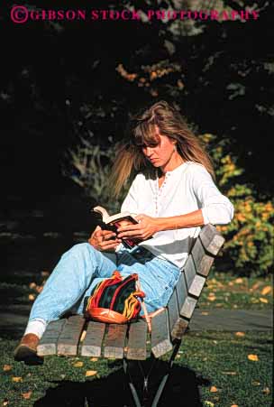 Stock Photo #2329: keywords - alone bench blond book education female fiction in learn outdoor park private quiet reading relax released sit solitude study summer vert woman