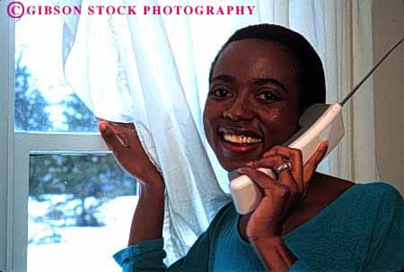 Stock Photo #2341: keywords - african alone american black communication cordless ethnic female happy home horz house minority outdoor phone private relax released smile summer talk telephone window woman