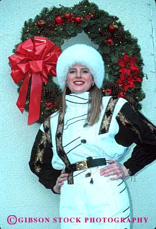 Stock Photo #2345: keywords -  beautiful career christmas clothing demonstrate display fashion female job model occupation outdoor perform pretty professional relax released show ski suit vert winter woman wreath