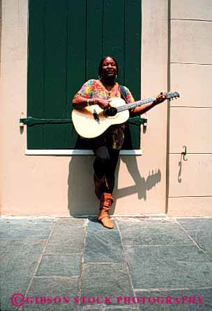 Stock Photo #2349: keywords -  african alone american artist black ethnic female guitar minority music outdoor play private public relax released skill summer vert woman