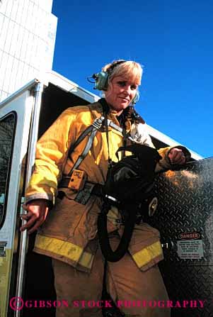 Stock Photo #2351: keywords -  career equipment female firefighter fireman firewoman job occupation public risk service suit truck uniform vert vocation