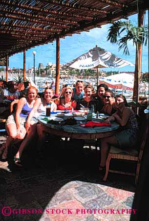 Stock Photo #2353: keywords - cafe dining female food fun group happy not outdoor photograph pose relationship relax released restaurant smile summer together vacation vert warm woman women