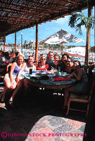 Stock Photo #2353: keywords -  cafe dining female food fun group happy not outdoor photograph pose relationship relax released restaurant smile summer together vacation vert warm woman women