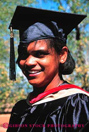 Stock Photo #2360: keywords - african american black cap college ethnic face female gown graduate graduated graduation happy head minority not outdoor people person relax released skin smile student summer vert woman