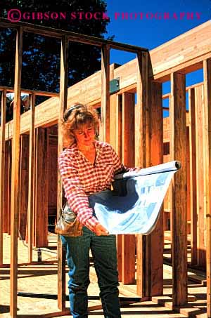 Stock Photo #2368: keywords - blue build career carpenter construction female frame home house job lumber new outdoor print profession read released skill study summer vert vocation woman wood work