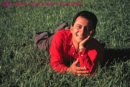 Stock Photo #2374: keywords -  alone ethnic face happy hispanic horz lawn male man minority outdoor relax released smile